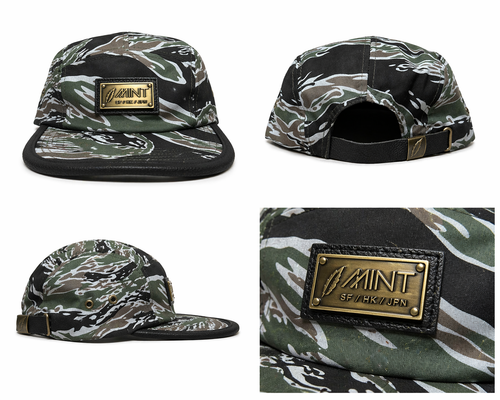Camouflage cap with a brand logo on a white background