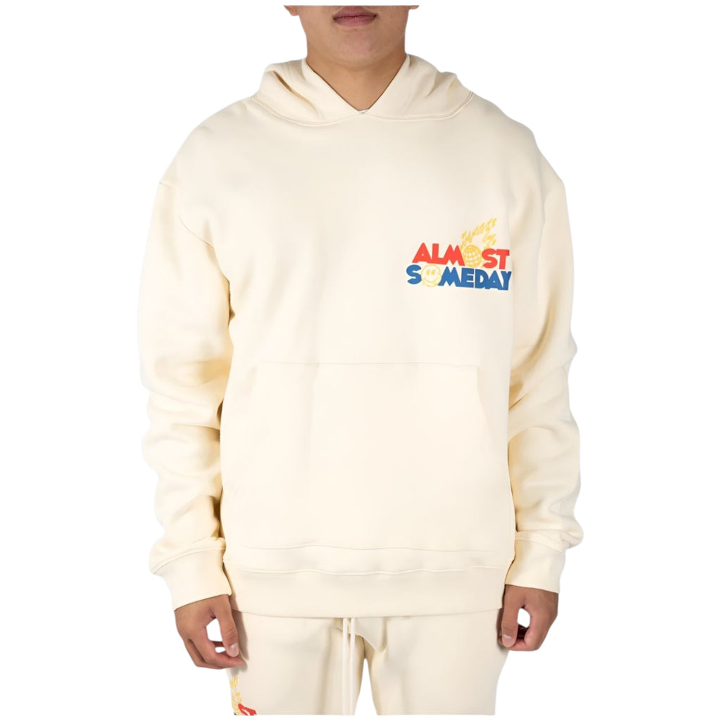 Person wearing a cream hoodie with 'Almost Someday' text on a white background