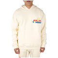 Person wearing a cream hoodie with 'Almost Someday' text on a white background