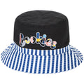 Black bucket hat with colorful 'Cookies' text and blue and white striped brim on a white background