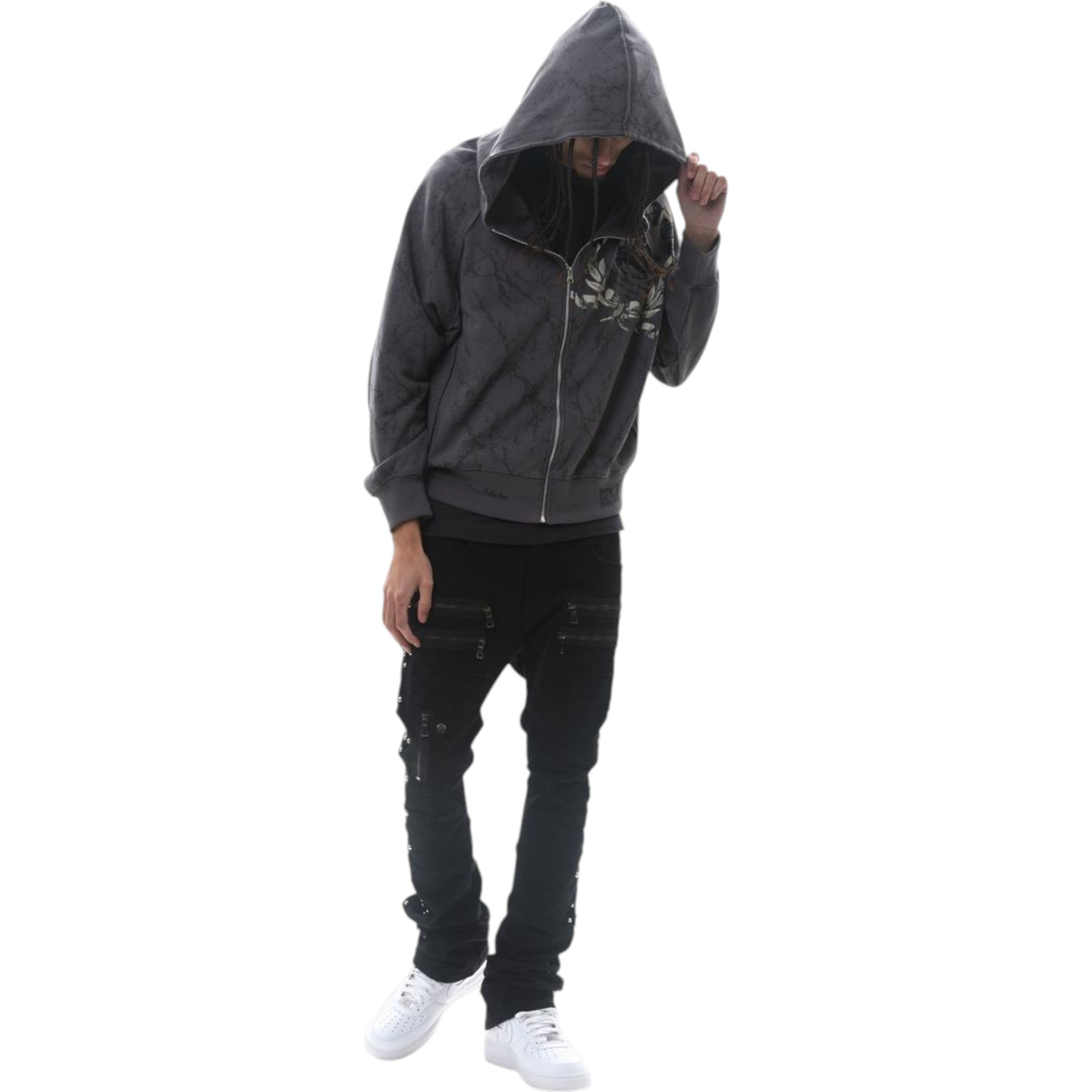 Person wearing a gray hoodie and black pants on a white background