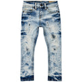 Distressed blue jeans on a white background