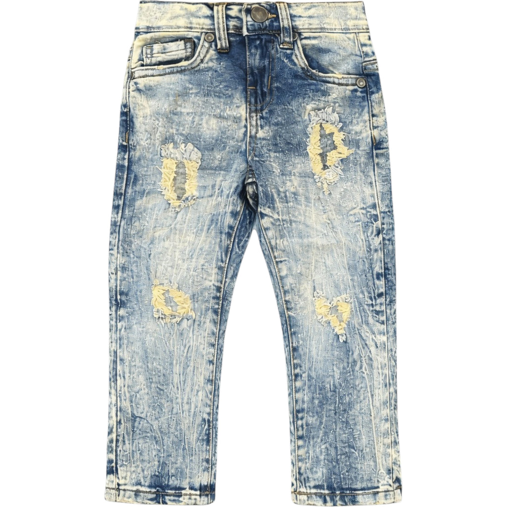 Distressed blue jeans on a white background