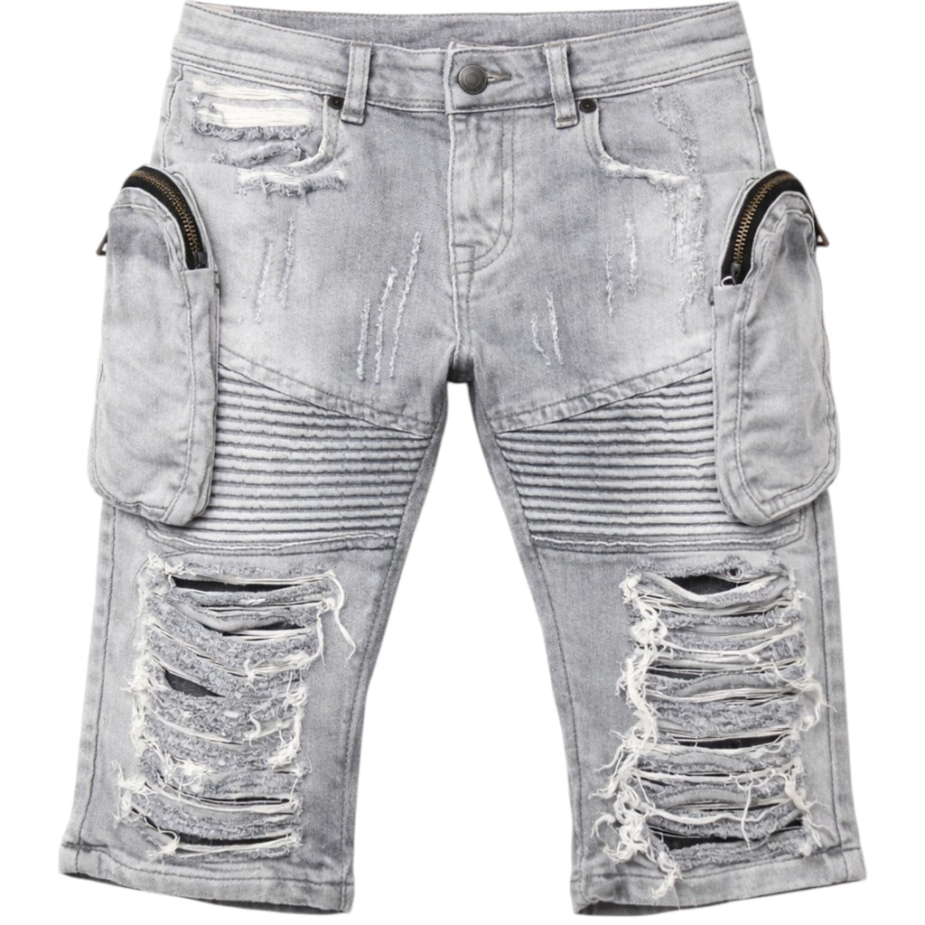 Distressed gray jeans with zippers and frayed edges on a white background