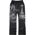 Black sweatpants with white graphics and text on a white background kids stacked pants 