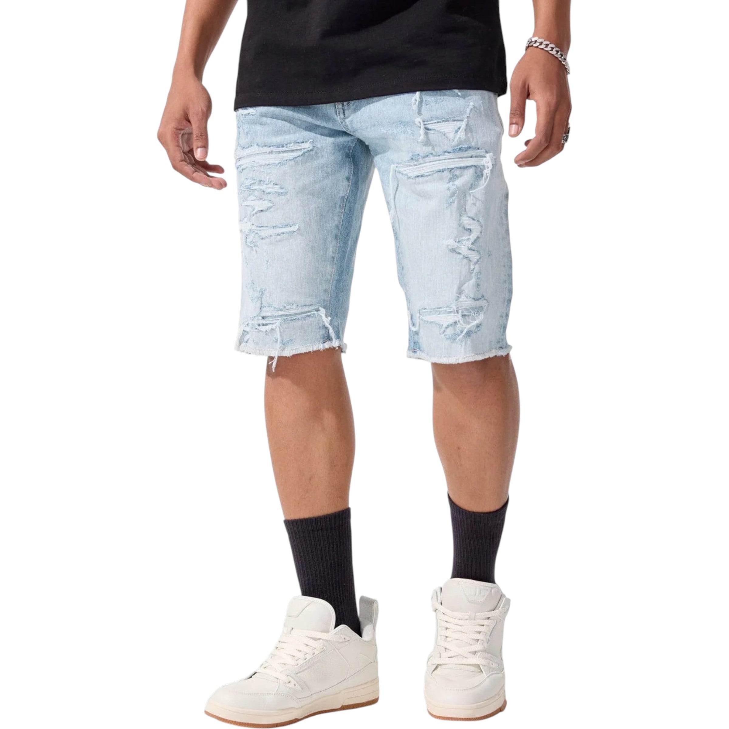 Light blue distressed denim shorts worn by a person on a white background
