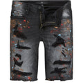 Black distressed denim shorts with colorful paint splashes on a white background