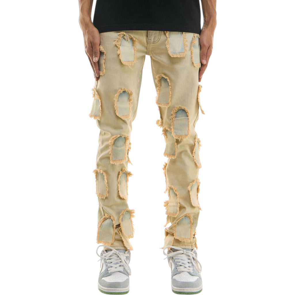 Beige distressed jeans worn by a person on a white background KDNK 'Flying Patched' Skinny Denim (Blue) KND4697
