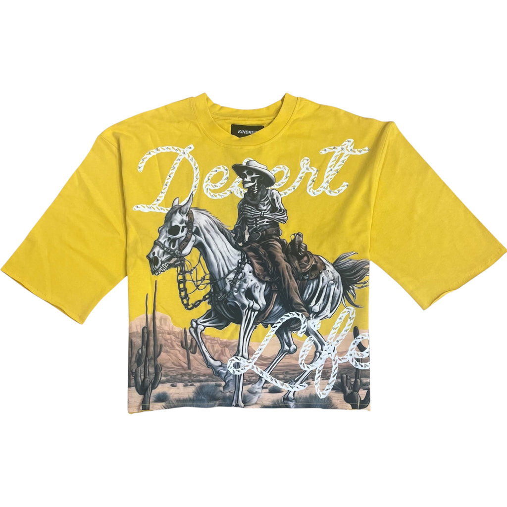 Yellow t-shirt with a graphic of a cowboy on a horse and the word 'Desert' on a white background