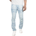 Light blue distressed jeans worn by a person on a white background