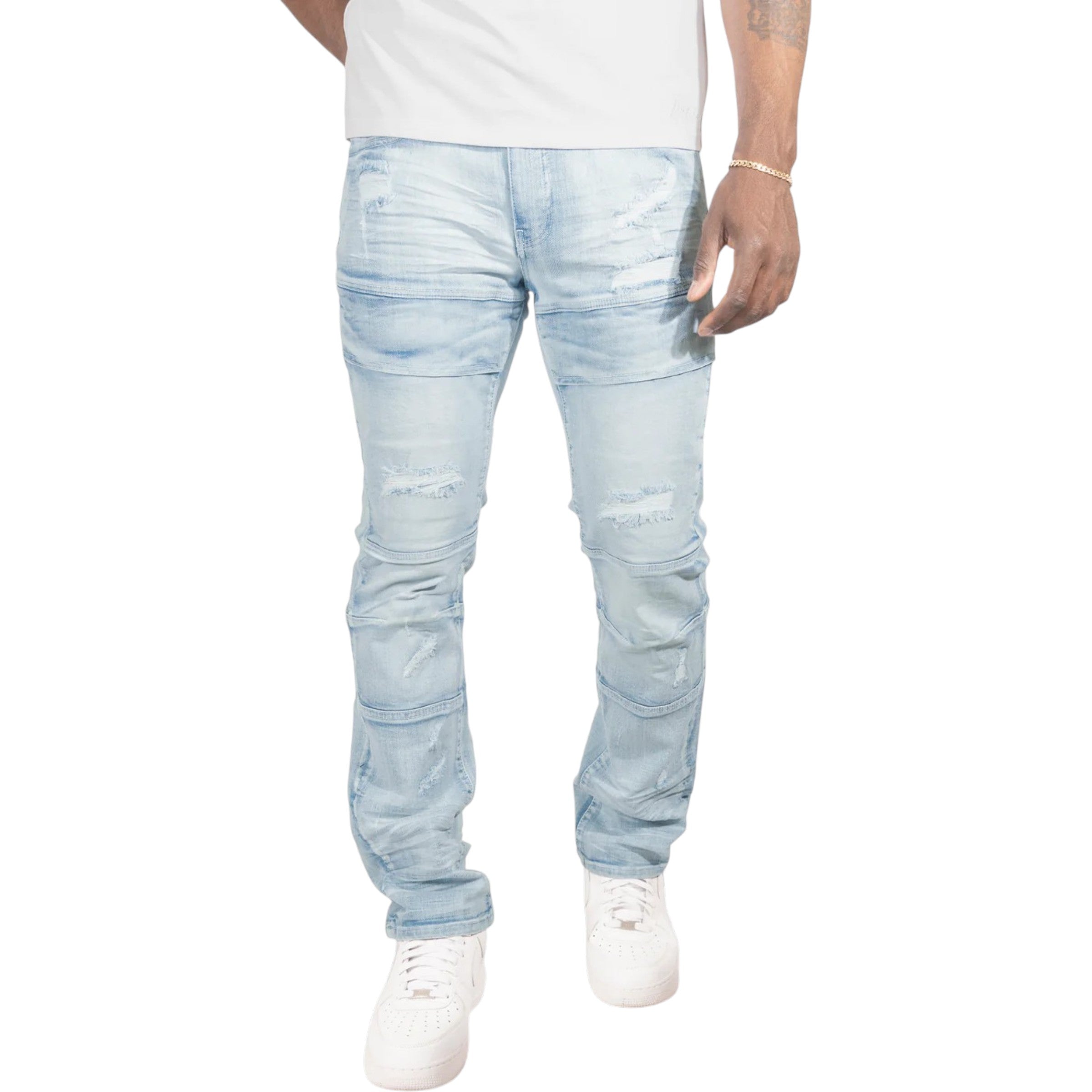 Light blue distressed jeans worn by a person on a white background