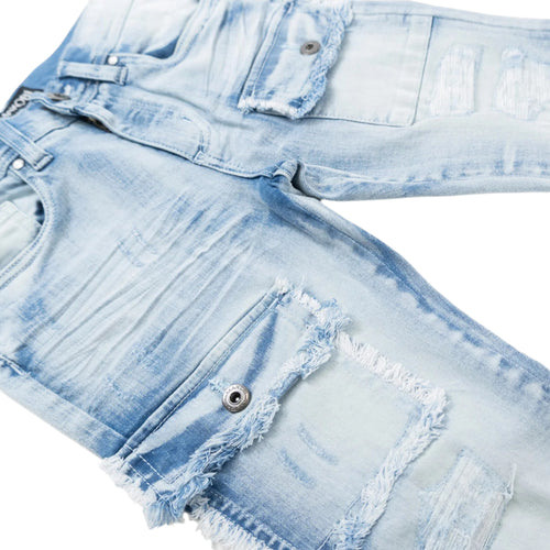 Light blue denim shorts with frayed edges on a white background