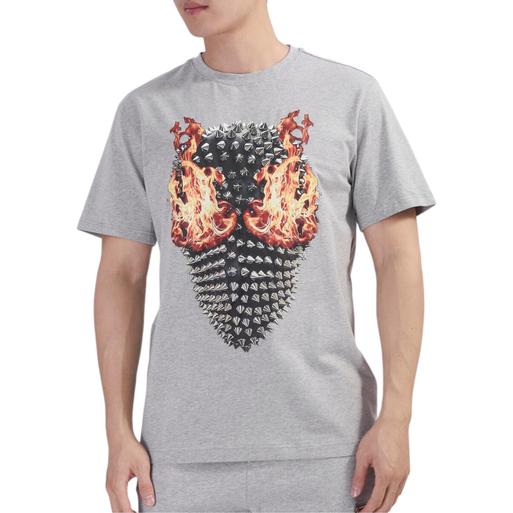 Person wearing a gray t-shirt with a unique design on a white background