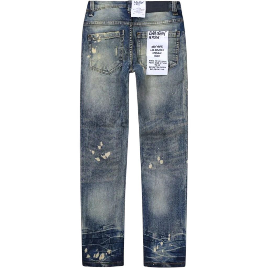 Distressed blue jeans with a tag on a white background
