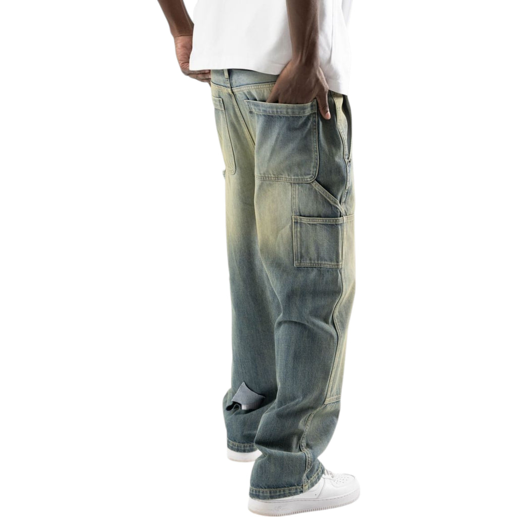 Blue jeans worn by a person on a white background