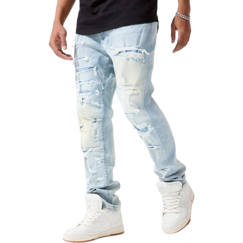 Light blue distressed jeans worn by a person on a white background