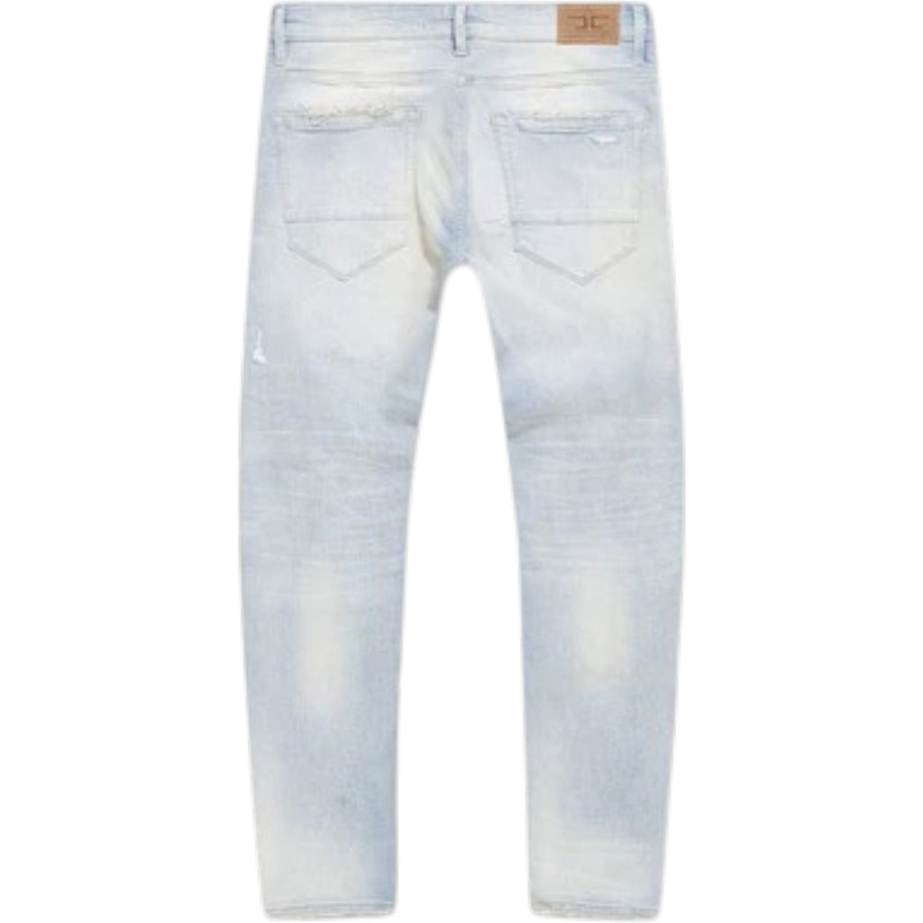 Light blue distressed jeans on a white background