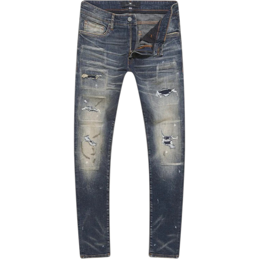 Distressed blue jeans on a white background
