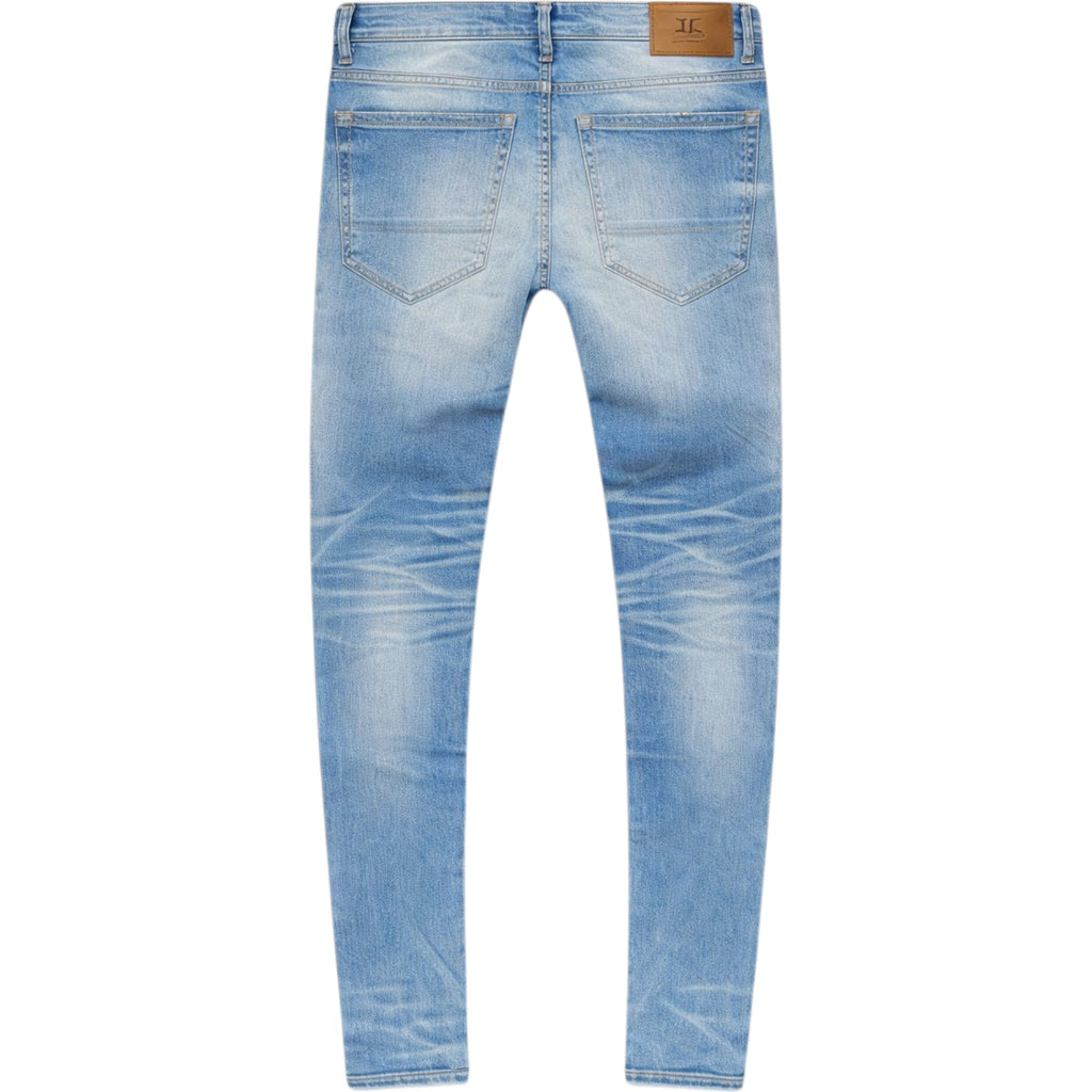 Light blue denim jeans on a white background