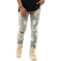 Ripped light blue jeans worn by a person on a white background