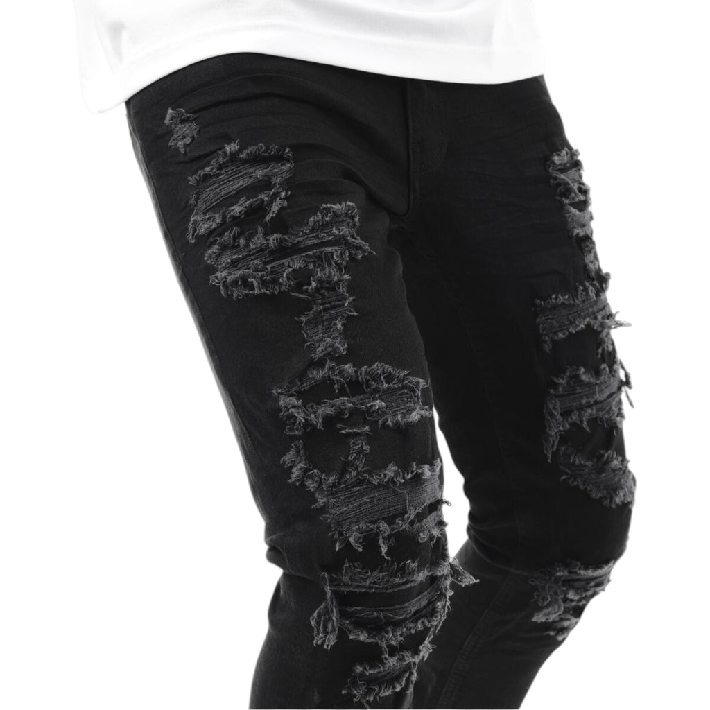 Black distressed jeans on a white background