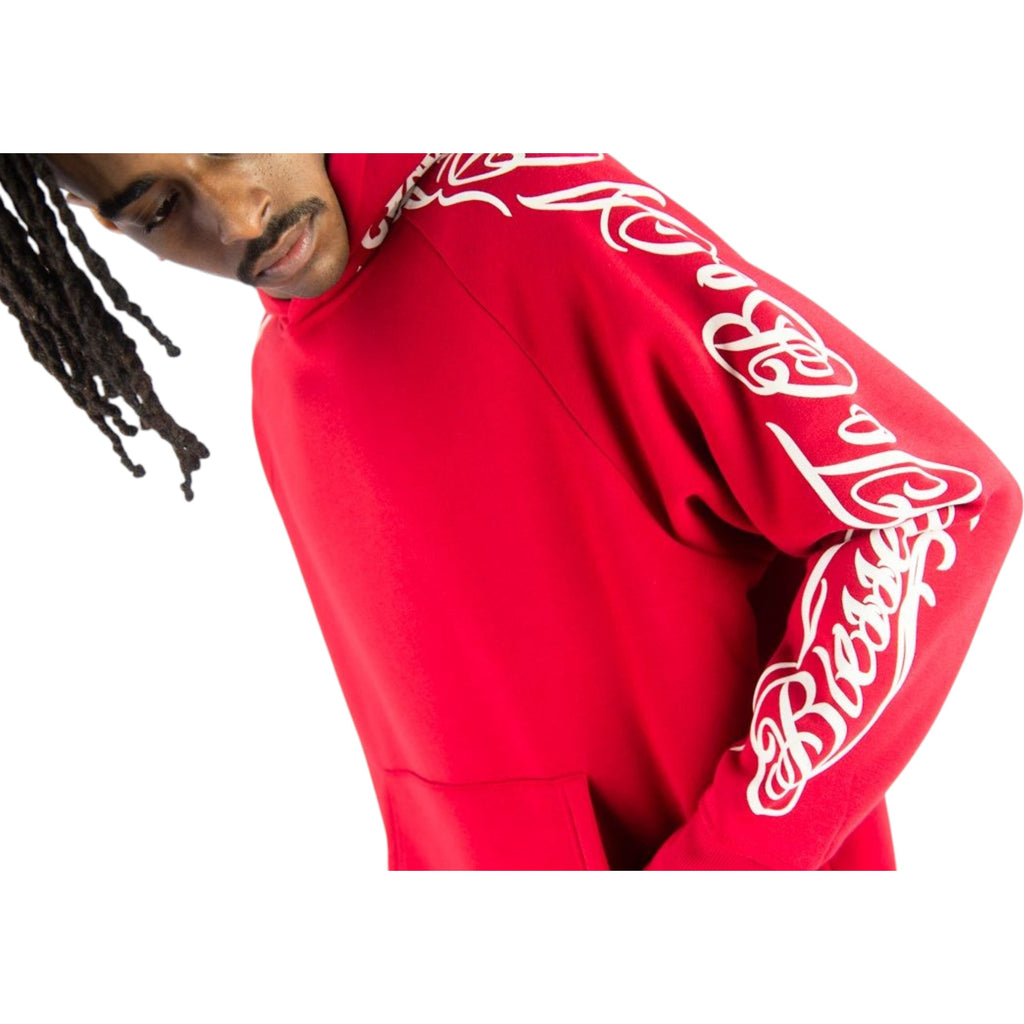 Person wearing a red hoodie with white text on a white background Rebel Minds 'Blessed' Fleece Hoodie (Red) 152-311