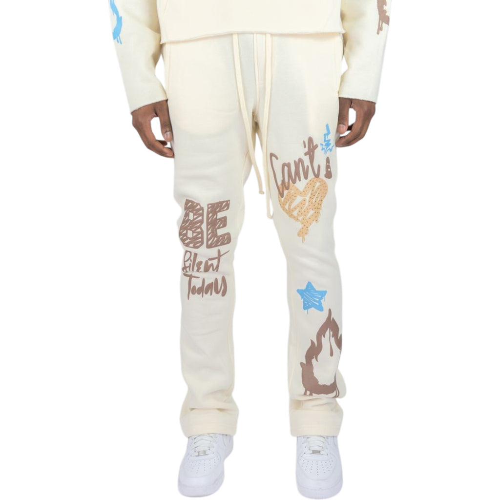 Cream-colored sweatpants with colorful text and graphics on a white background
