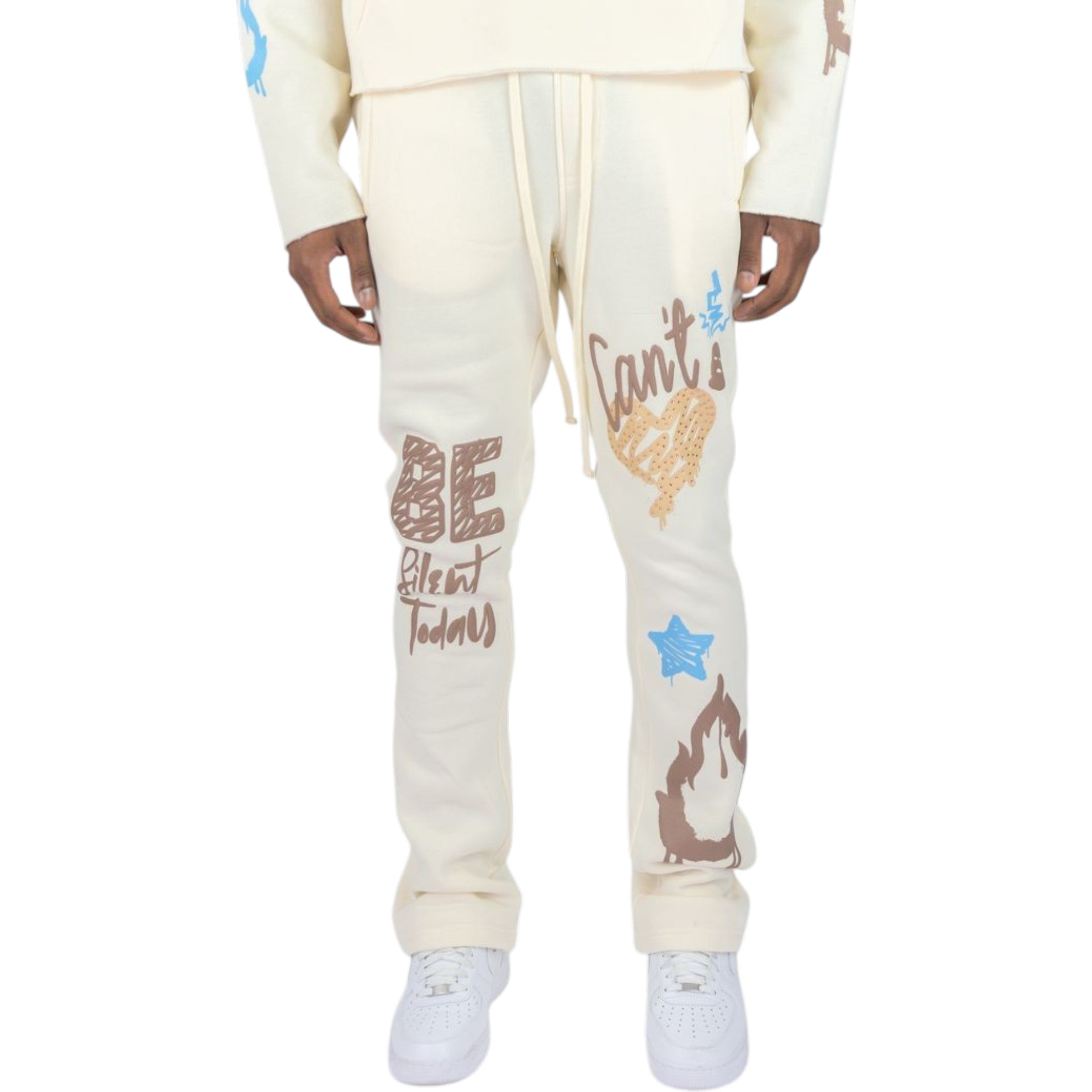 Cream-colored sweatpants with colorful text and graphics on a white background