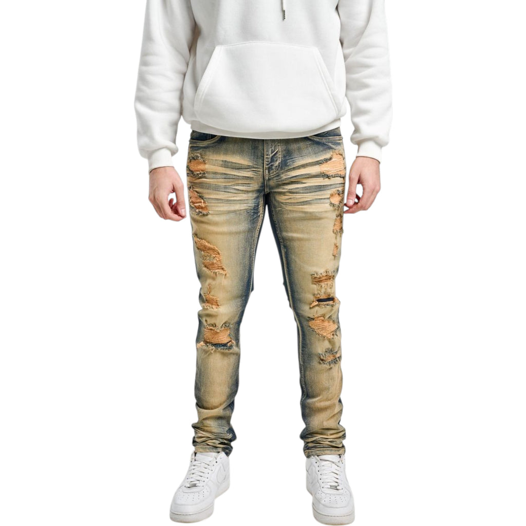 Person wearing distressed light blue jeans and a white hoodie on a white background