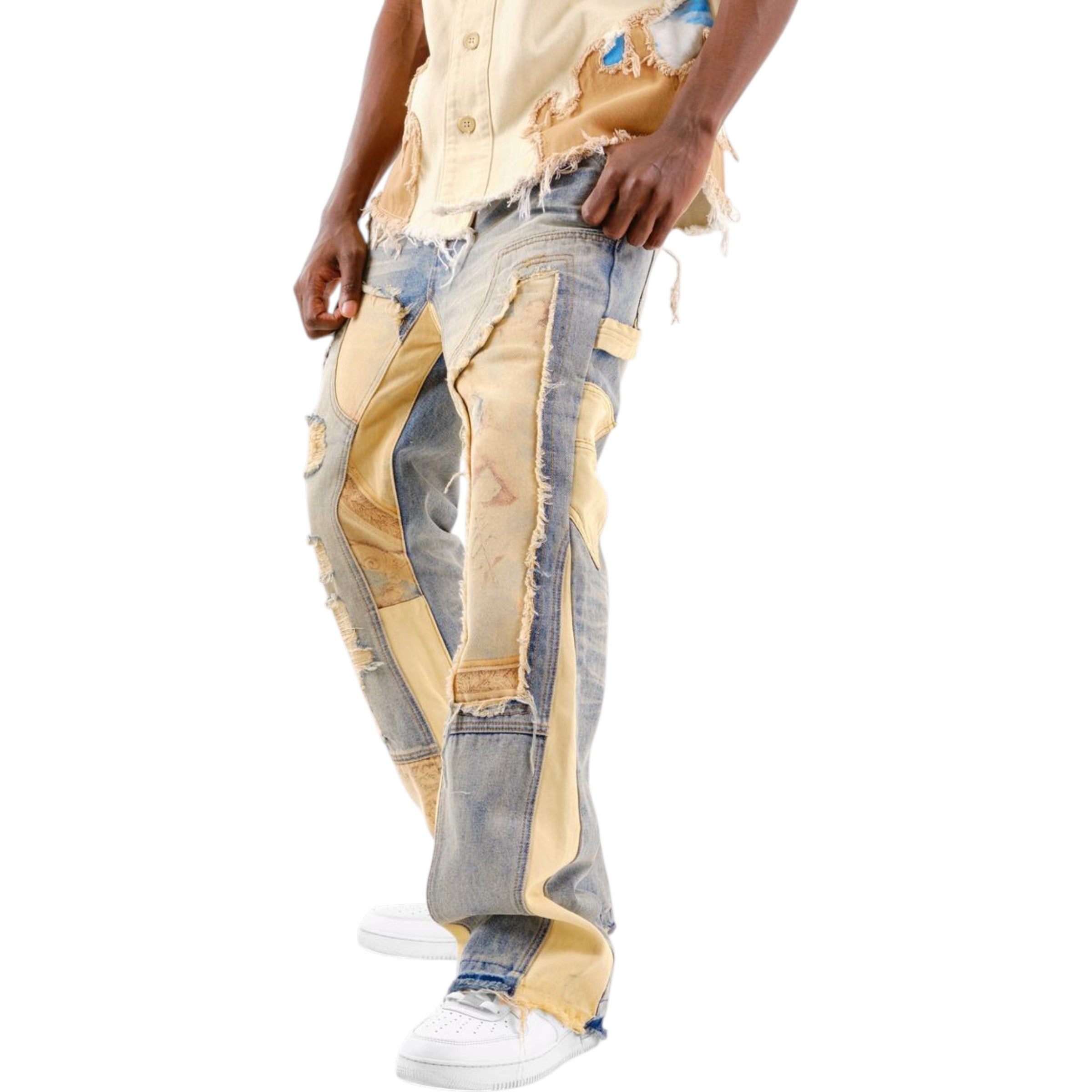 Person wearing a patchwork-style denim outfit on a white background