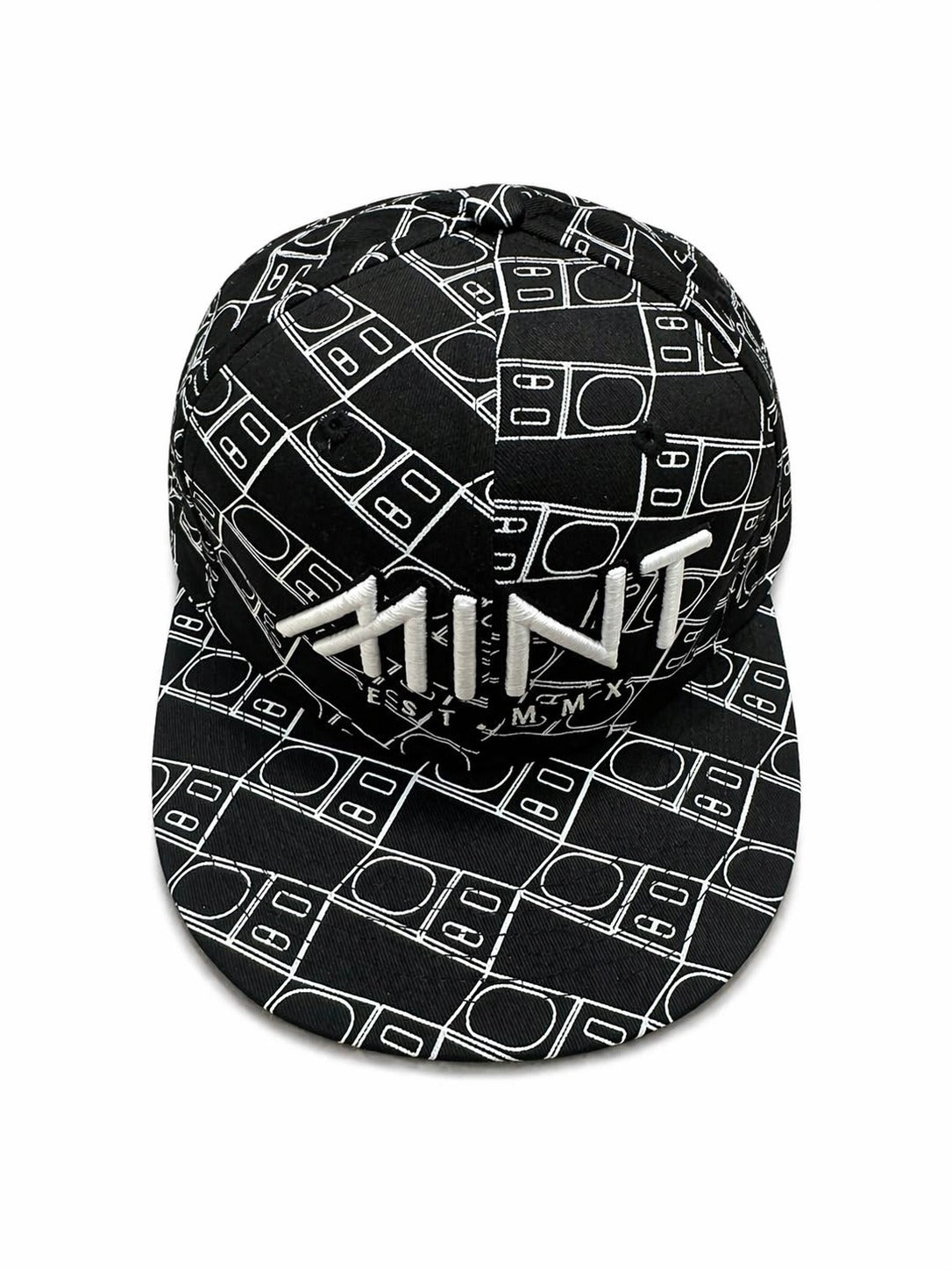 Black cap with white pattern and 'MINT' branding on a white background