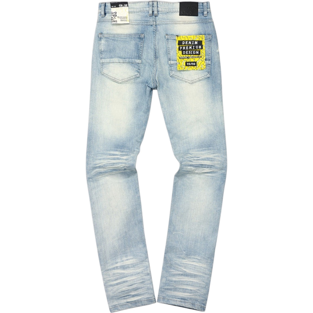 Light blue distressed jeans with a brand label on a white background
